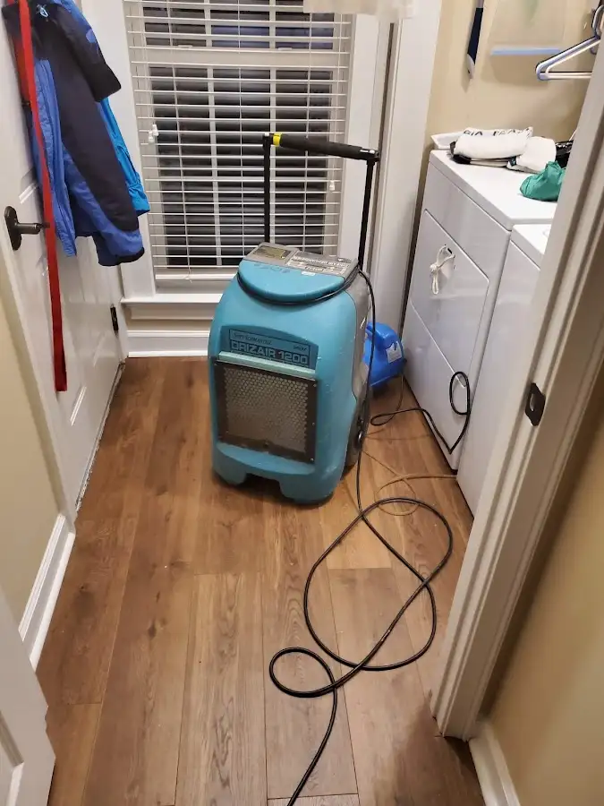Commercial dehumidifier deployed for Flood Damage Cleanup in Wall